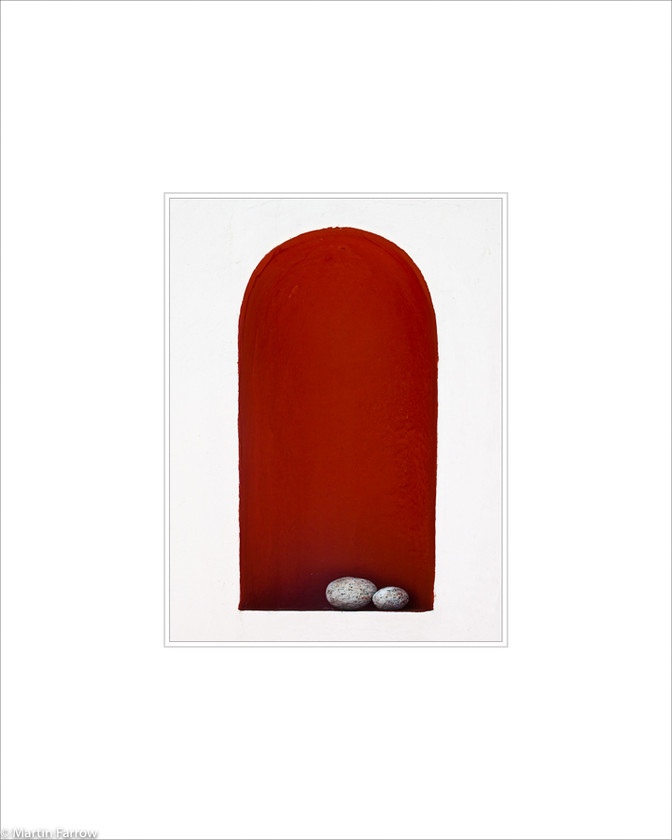 08 Pebbles 
 Red alcove with pebbles in white wall 
 Keywords: ARPS panel fine art white simple abstract graphic architecture red arch alcove pebble stone contrast wall Santorini Greece island