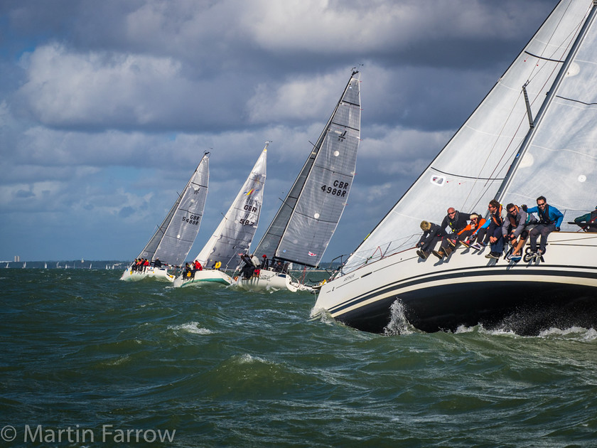 Racing-Yachts 
 Line of yachts racing to windward in strong wind 
 Keywords: Battle of Britain, RAFYC, Solent, boats, crew, racing, rally, sails, sea, water, waves, wind, yachts