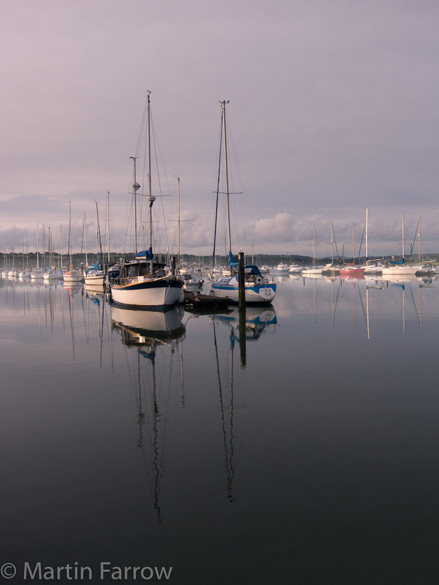 Folly-Morning 
 Early morning boats moored in river 
 Keywords: IoW, boat, sailing,moored,river,yacht,morning,mist,still,calm,water,shore,coast