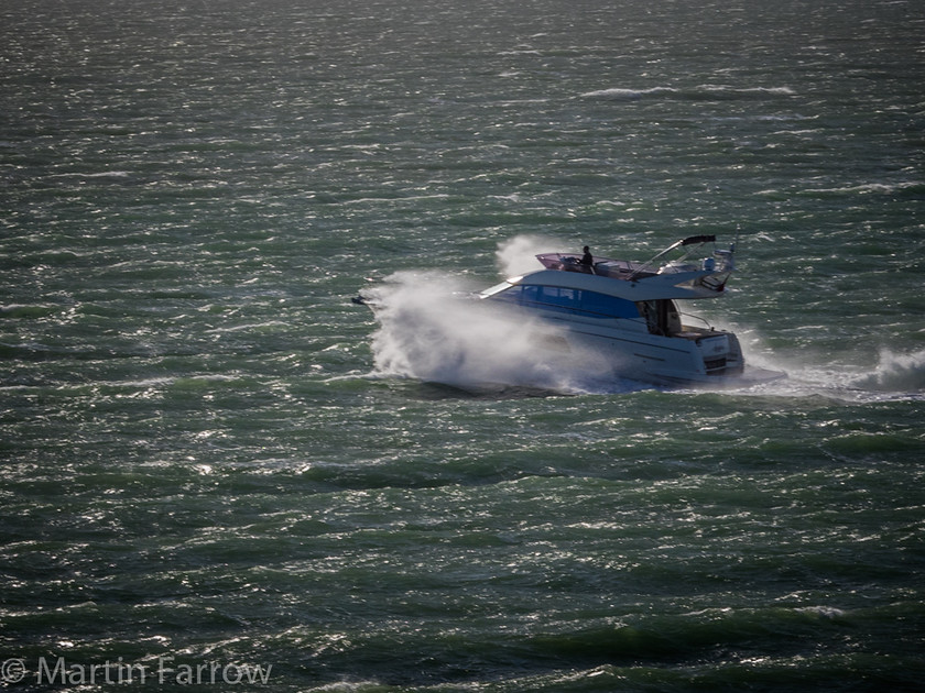 Rough-Passage 
 Power boat crashing through waves in windy sea 
 Keywords: Cowes, Solent, boat, boats, ocean, powerboat, rough, sea, spray, water, waves, windy