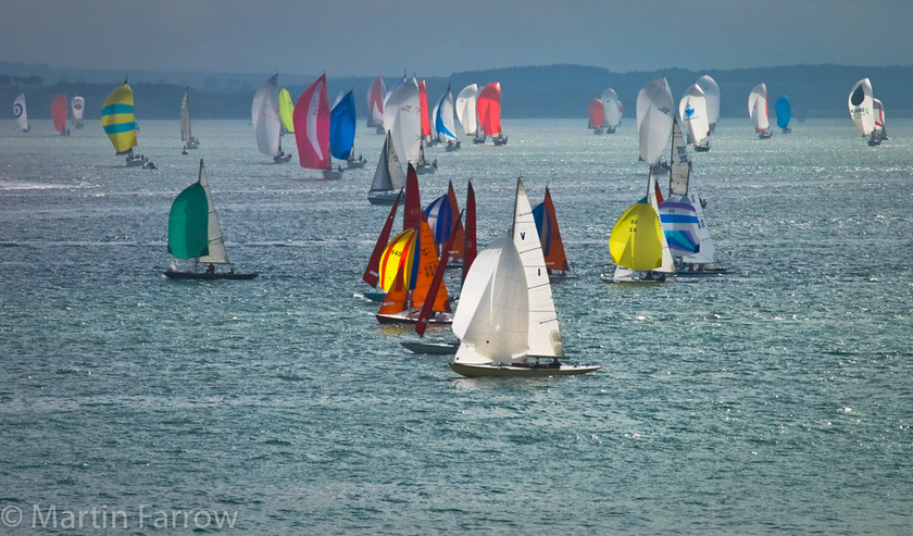 Solent-Sails 
 Yachts racing with coloured sails 
 Keywords: Cowes Week, boats, sailing, sea, yachts,group,race,racing,colour,sails,water,ocean,wind