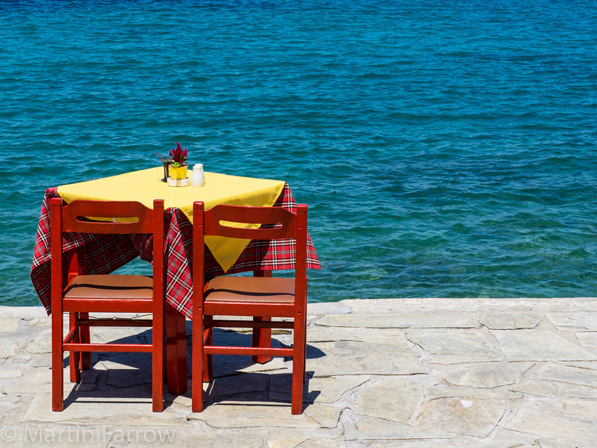 Table-For-Two 
 Table for two on water front 
 Keywords: Greece, Samos, table,chair,two,water,shore,sea,ocean,yellow,blue,quiet,waiting