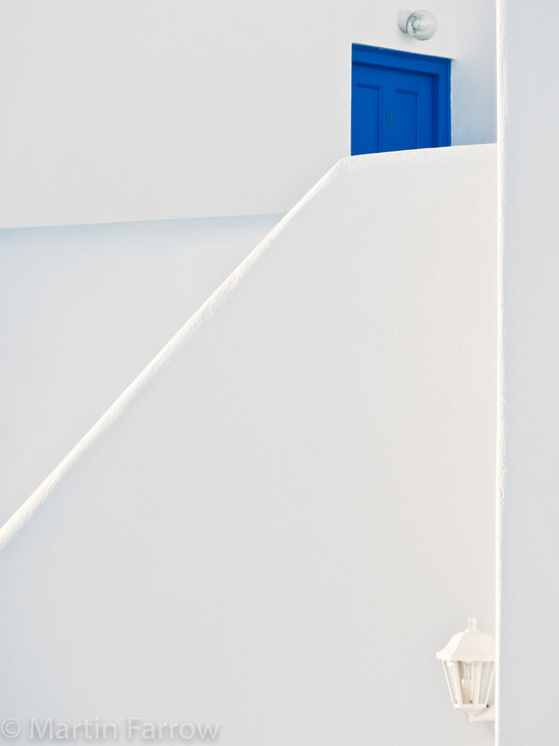 Blue-Door 
 Blue door in white walls 
 Keywords: Greece, Mykonos,blue,white,wall,door,high key